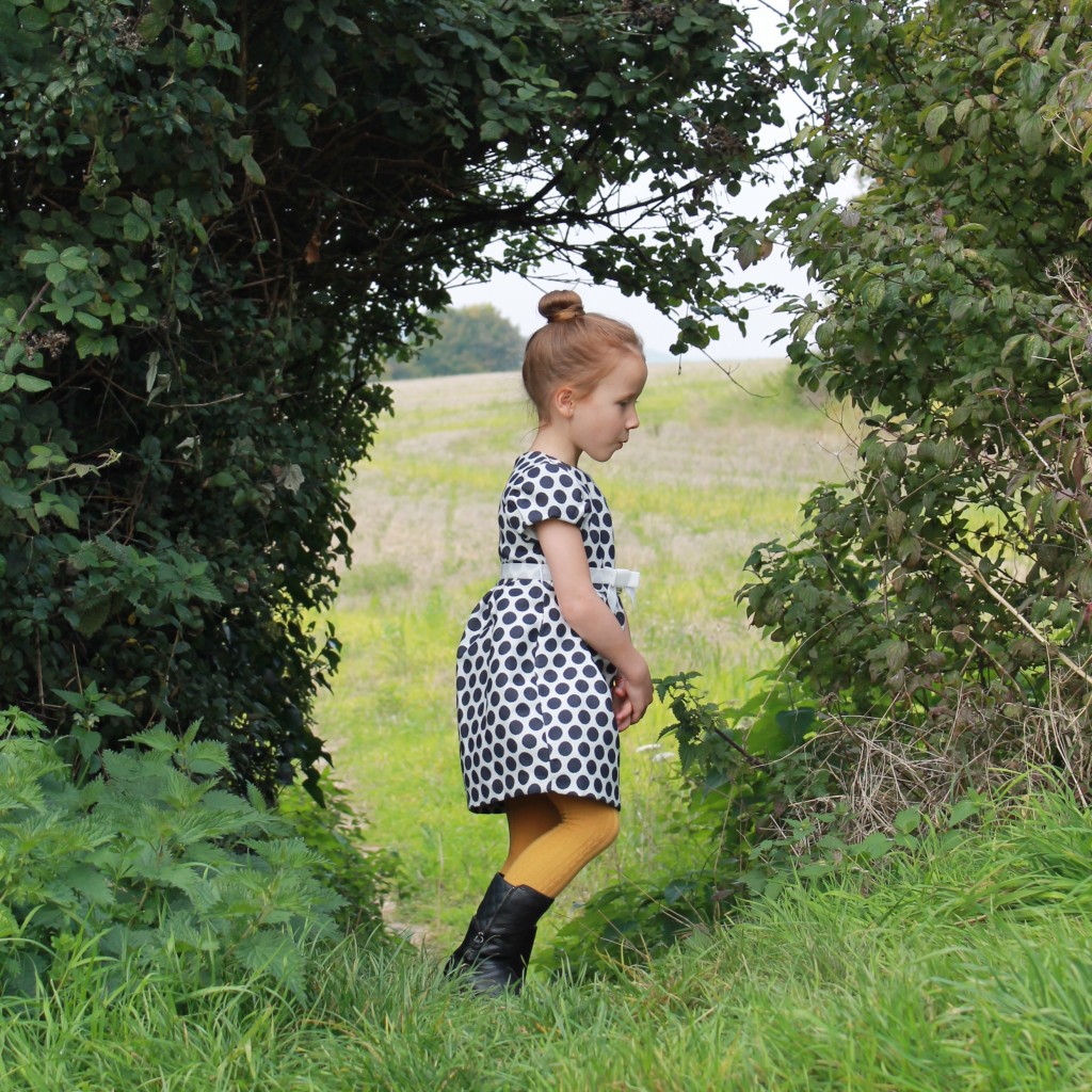 party dresses for girls - side on shot with fields in background