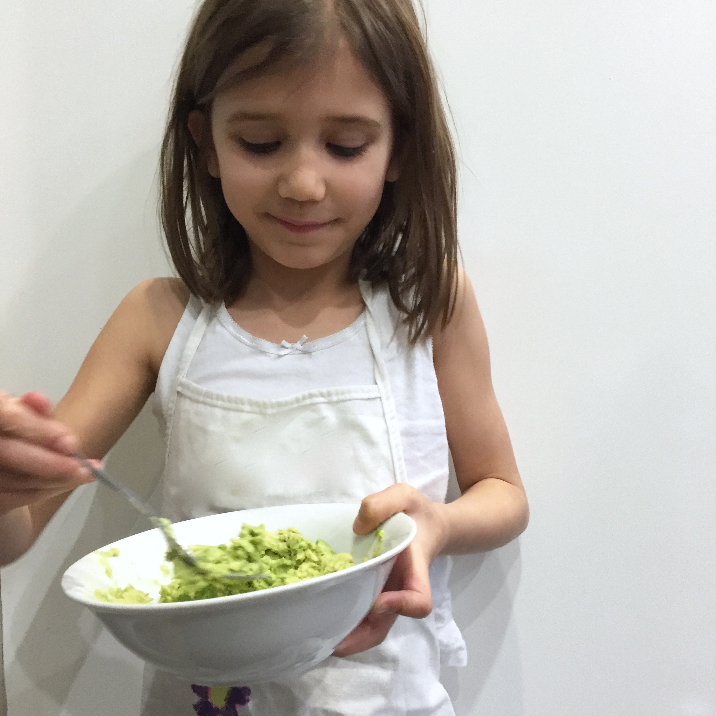 mashing avocado