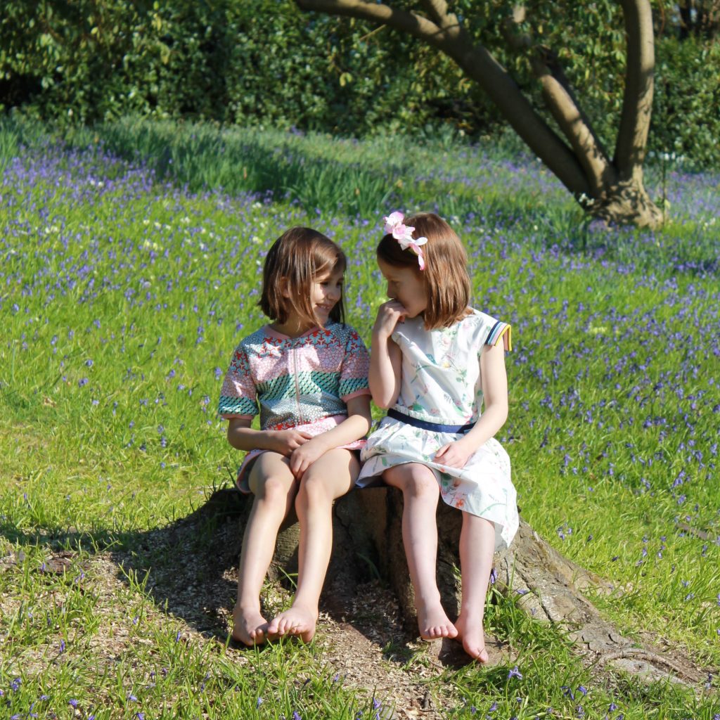 school holiday activities - girls sitting in park