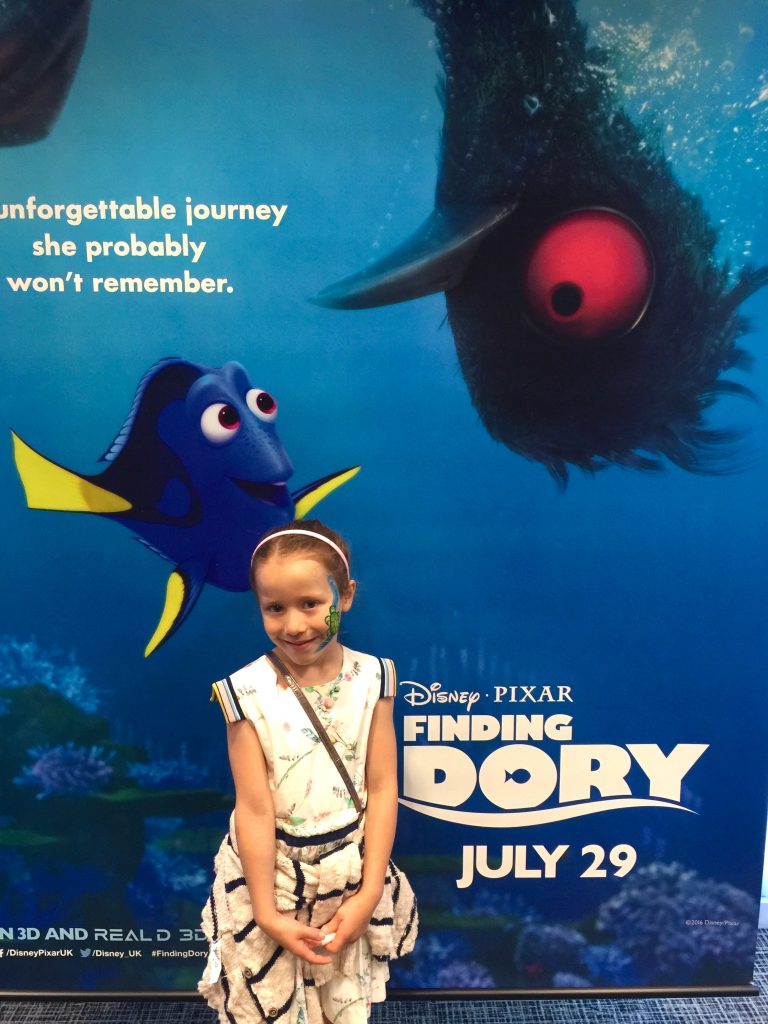 Finding Dory preview - Lil Sis in front of the promotional poster