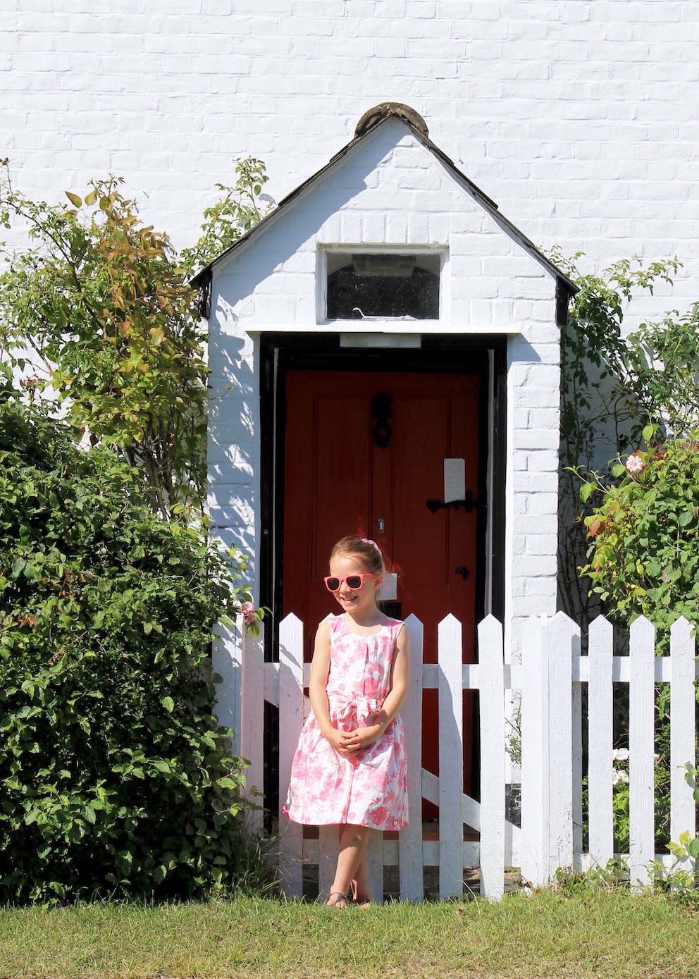 hatley in front of cottage