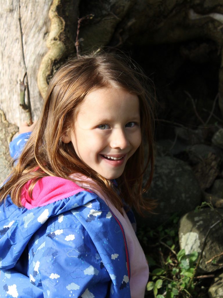 Lil Sis kids' outdoor clothing by tree