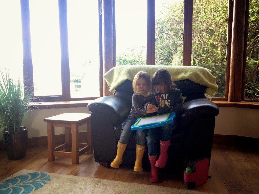 Family friendly cottages in Cornwall girls in lounge