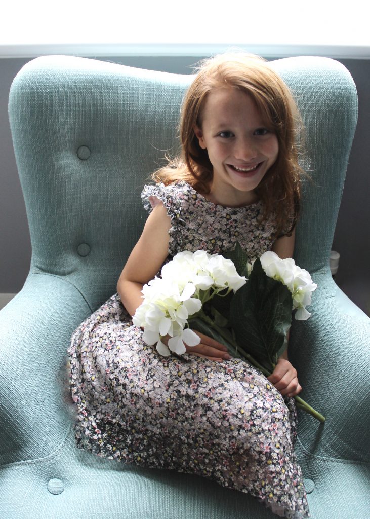 Sloane & Sons angel chair smiling