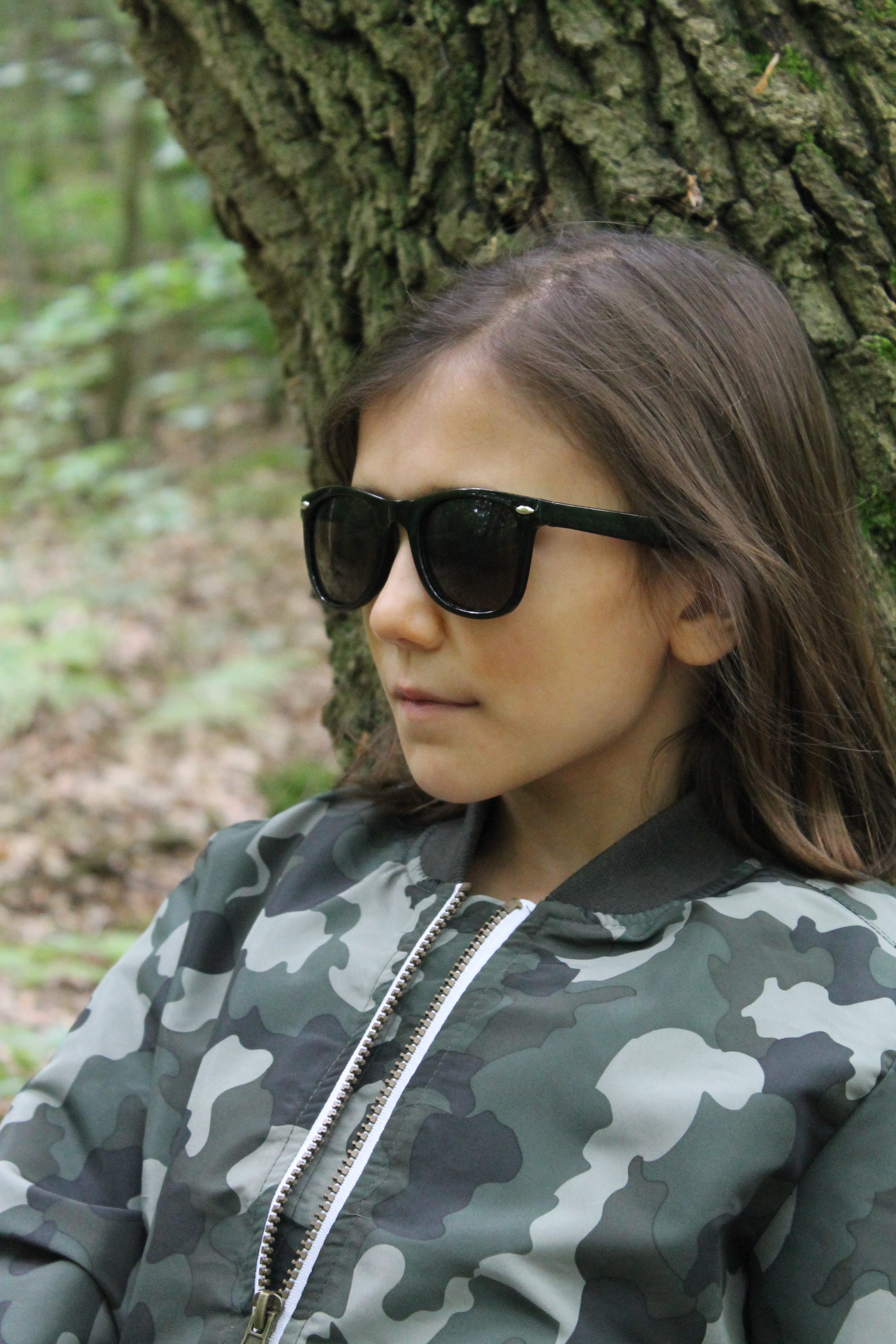 kids' camouflage bomber jacket sunglasses leaning