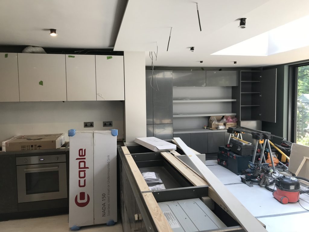 kitchen diner renovation cupboards being installed