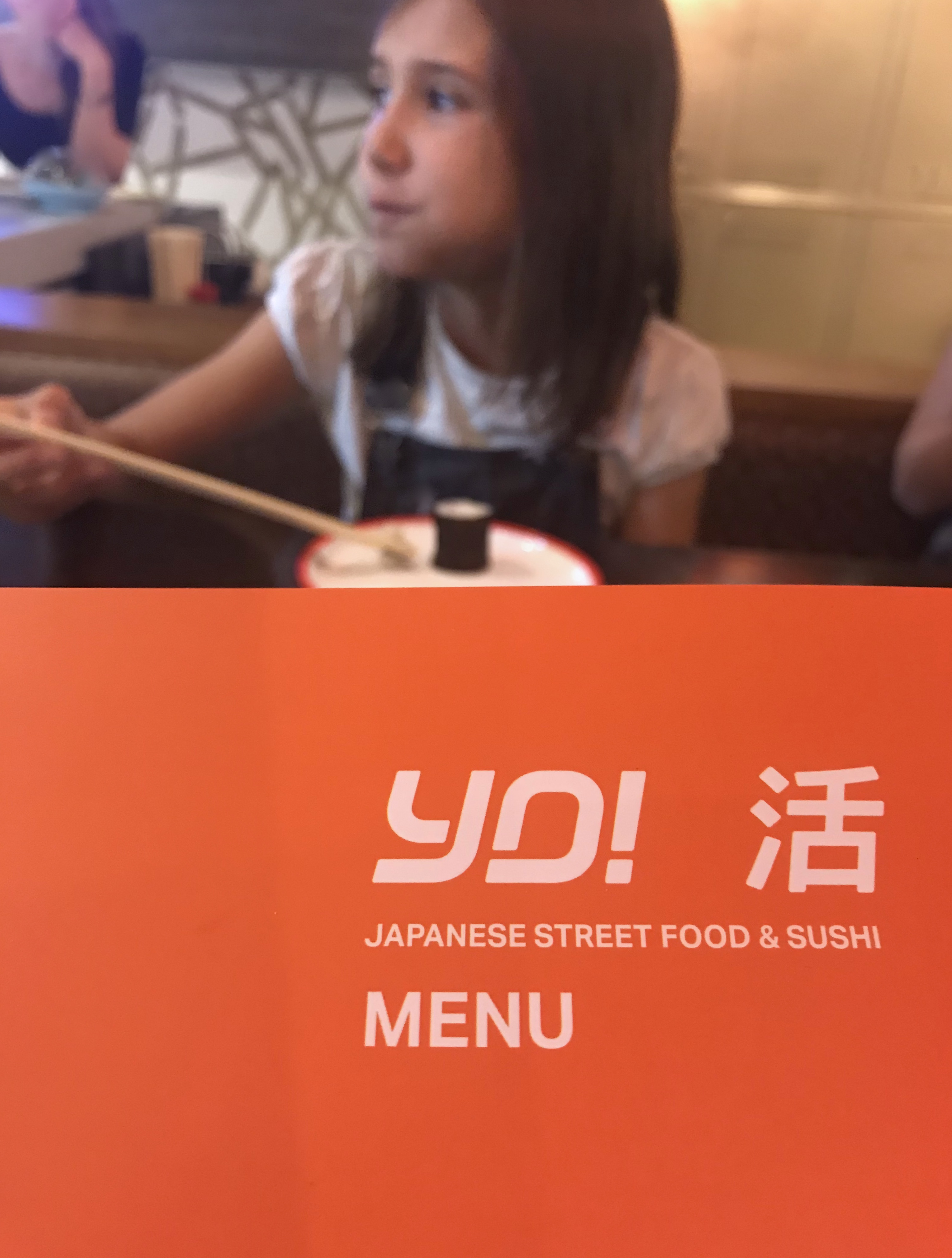 Yo Sushi! Kids' Menu holding