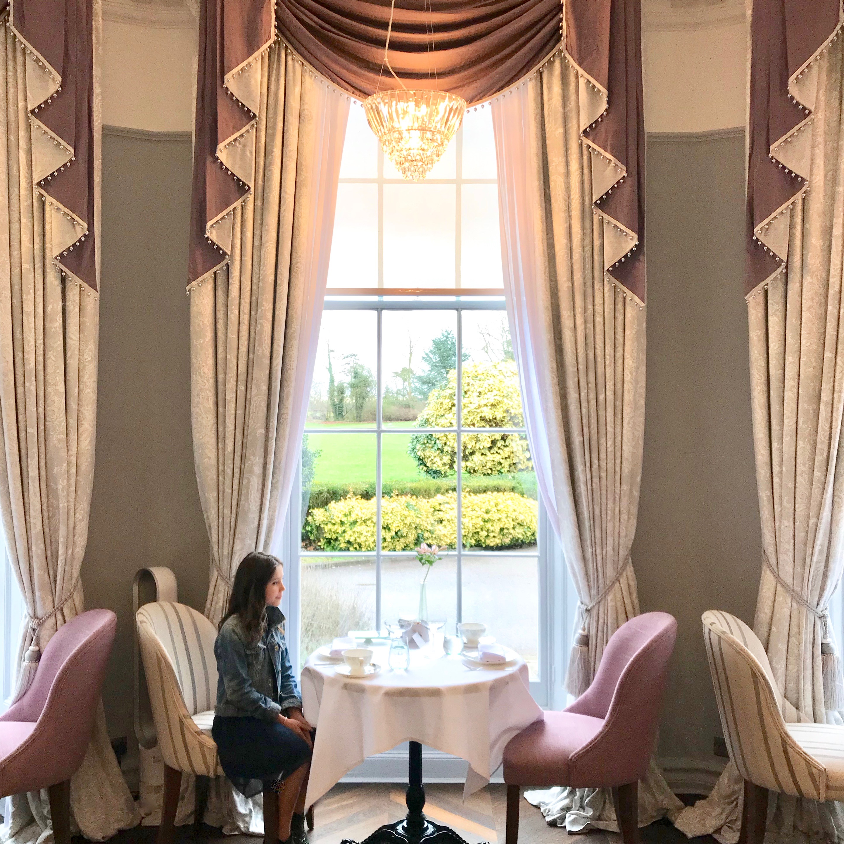 Laura Ashley tea room Burnham Beeches - Big Sis sitting by floor-to-ceiling window