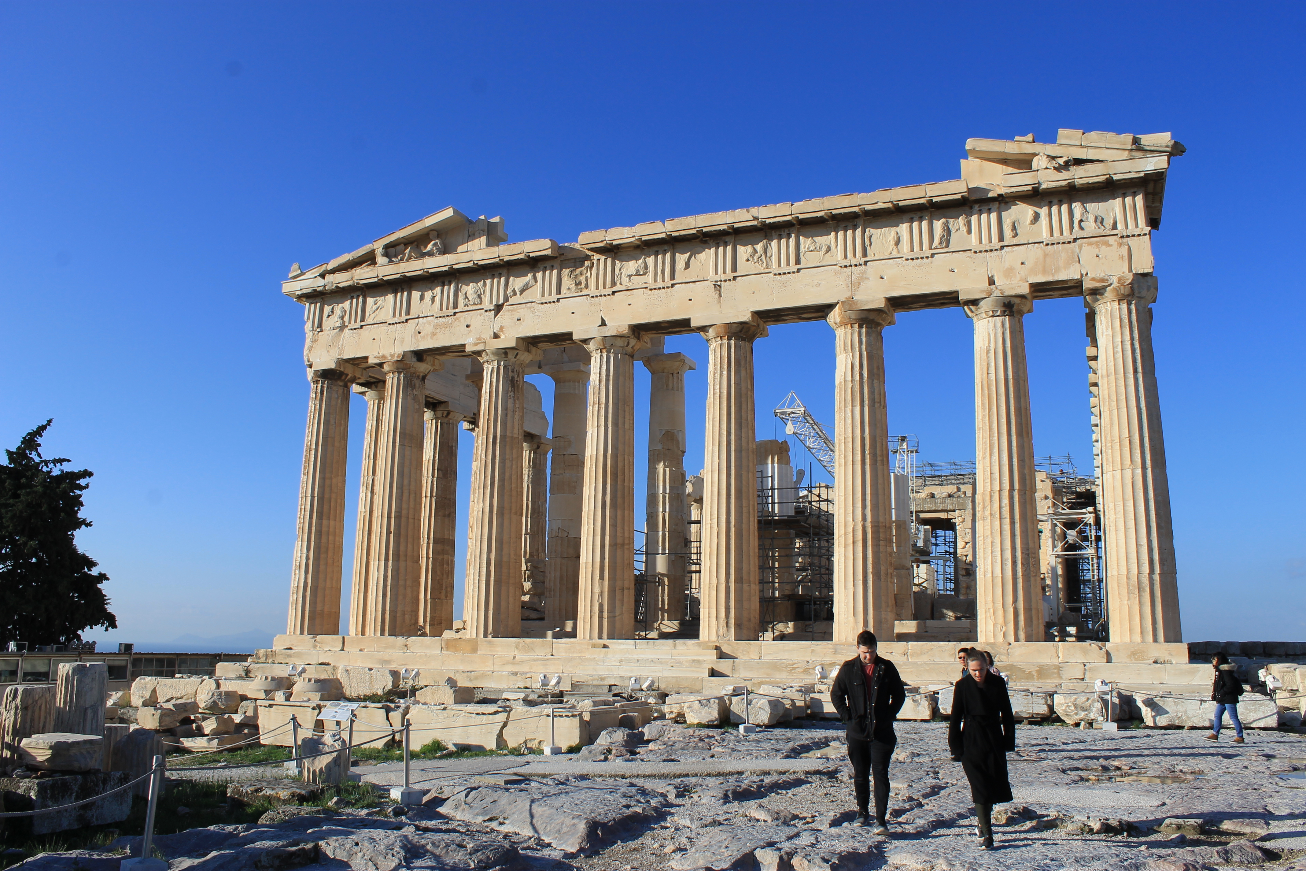 Visiting the Parthenon in Athens landscape view with people in foreground