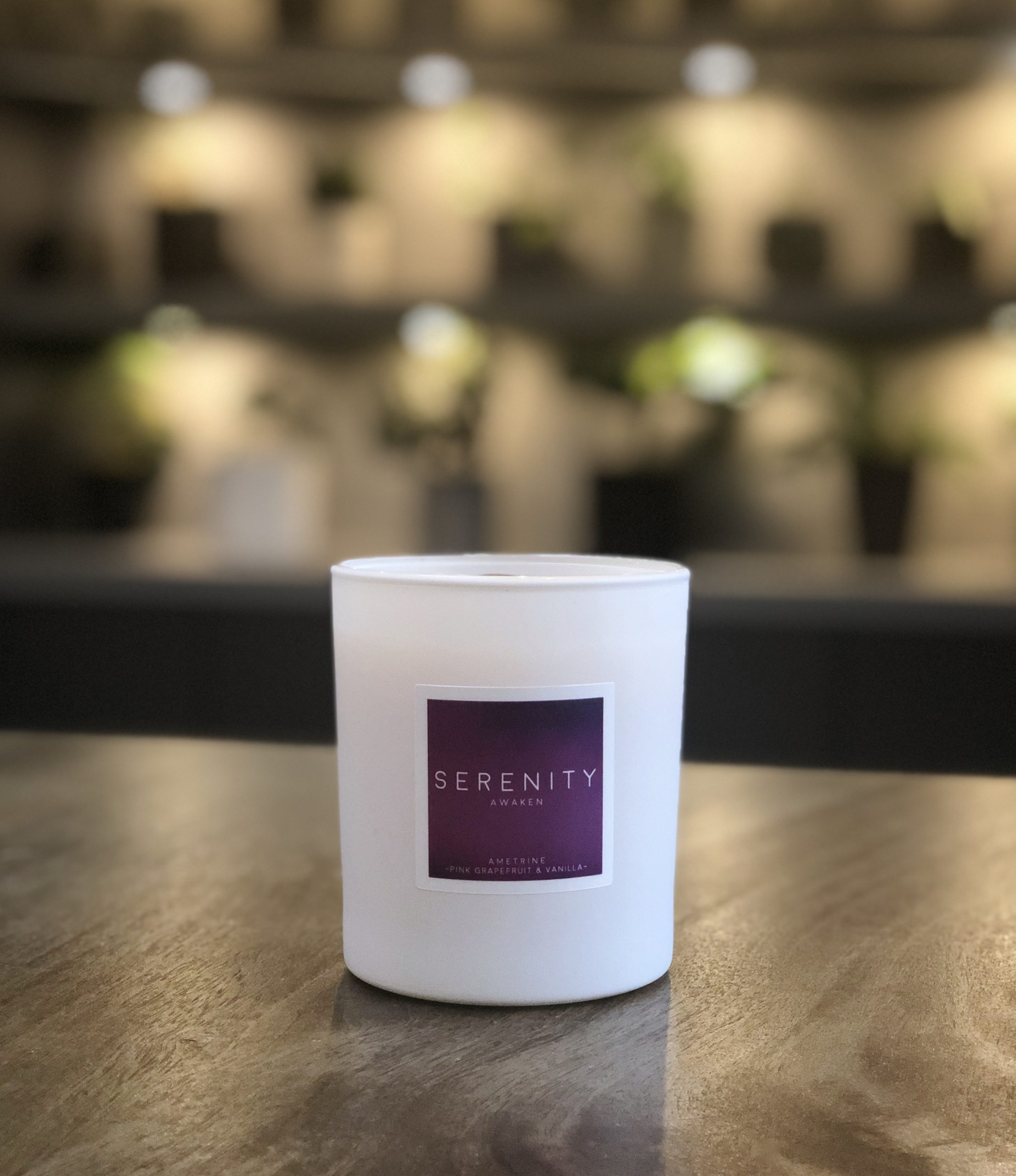 scented candle with a healing crystal single candle shot
