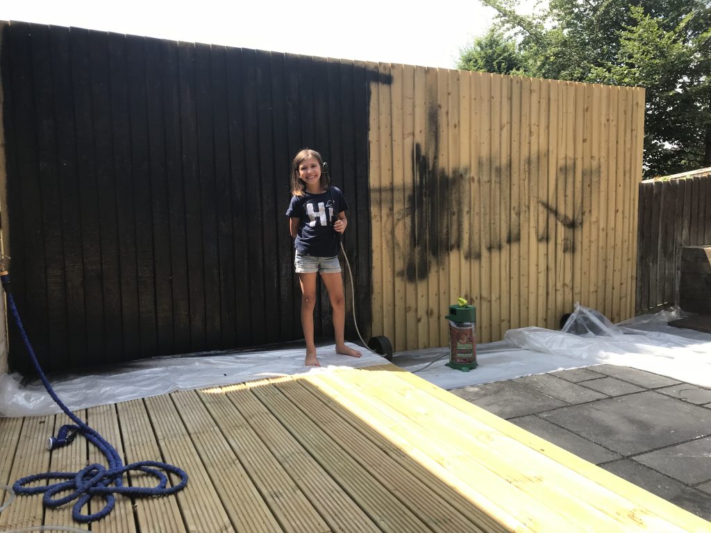 budget garden renovation - L helping with painting