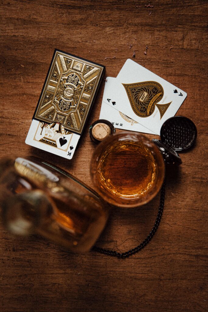 Guilty Musical Pleasure - shot of whiskey and poker cards